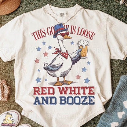 a white t - shirt with a goose wearing a hat and holding a beer
