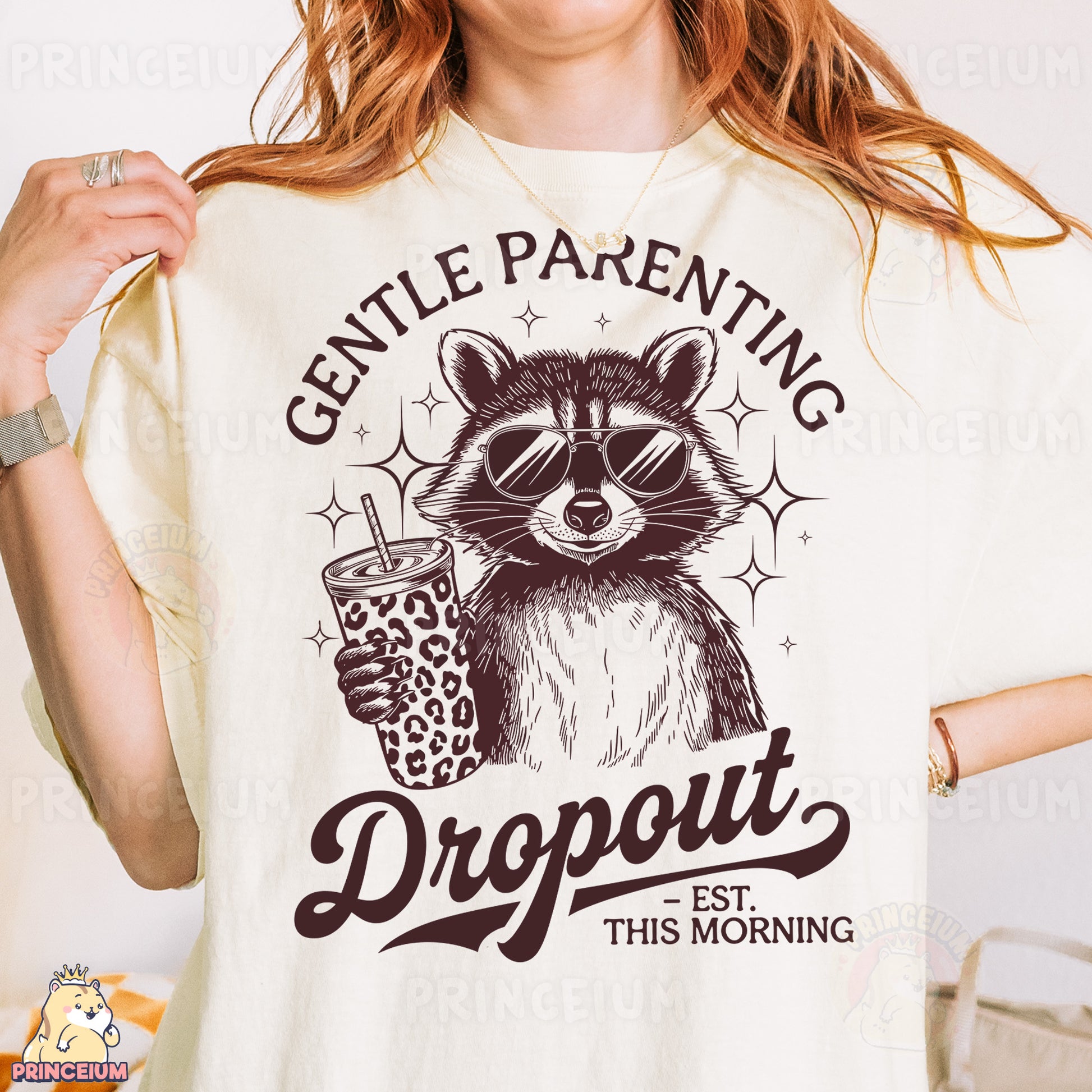 a woman wearing a t - shirt with a raccoon holding a drink