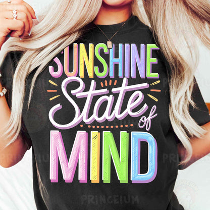 a woman wearing a black shirt that says sunshine state of mind