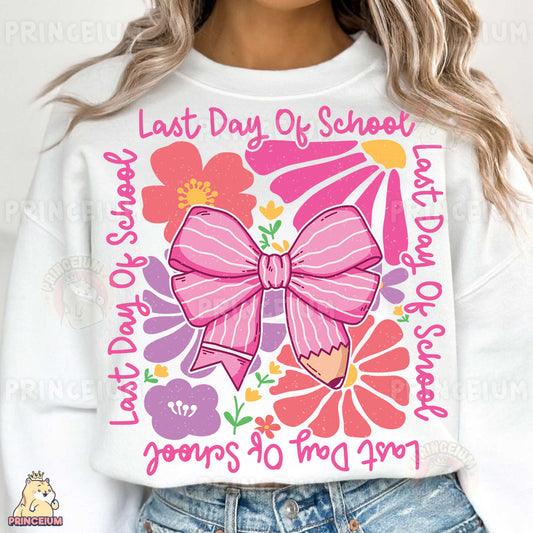 a woman wearing a white sweatshirt with a pink bow