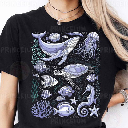 a woman wearing a black t - shirt with a picture of a whale and other