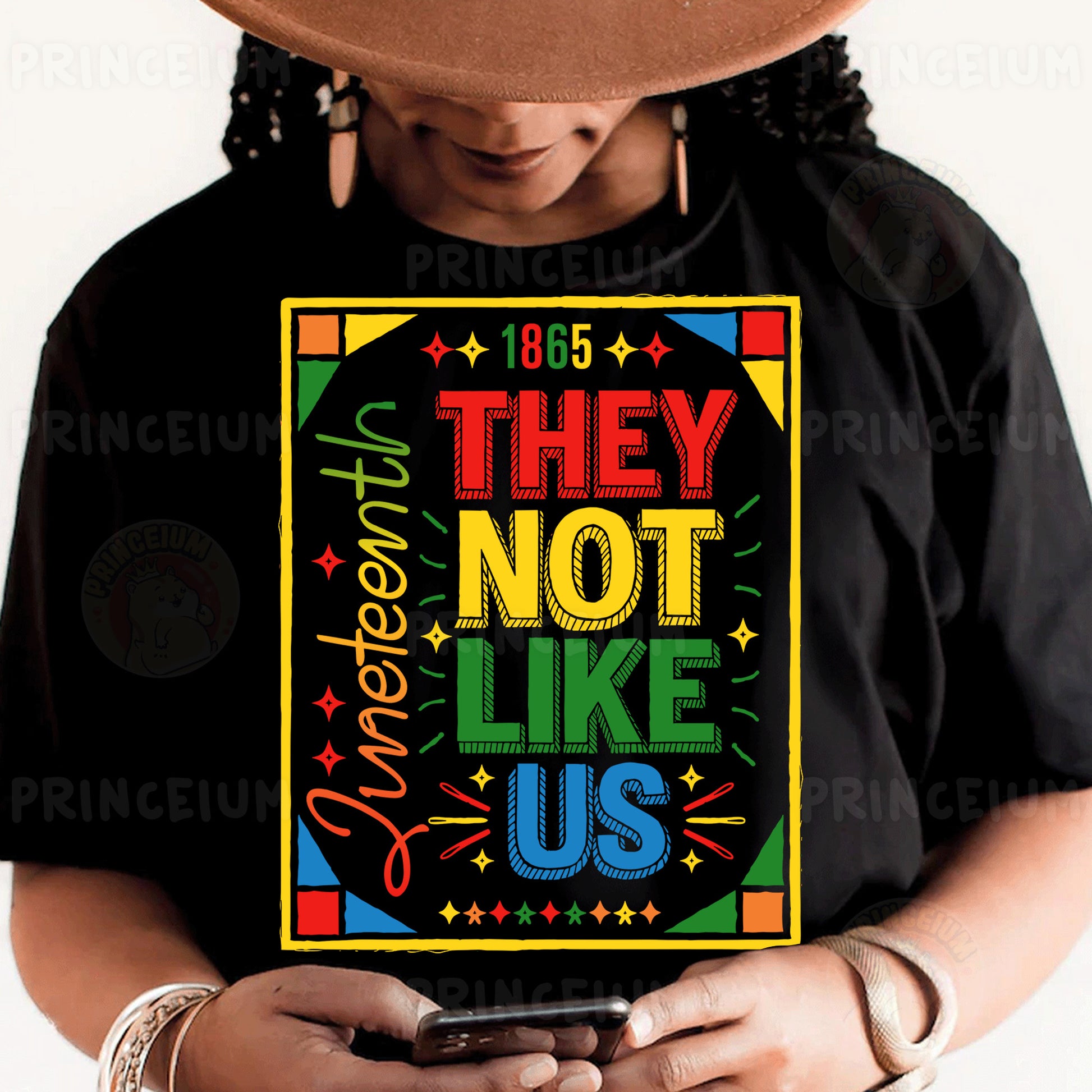 a person wearing a black shirt and a hat holding a cell phone