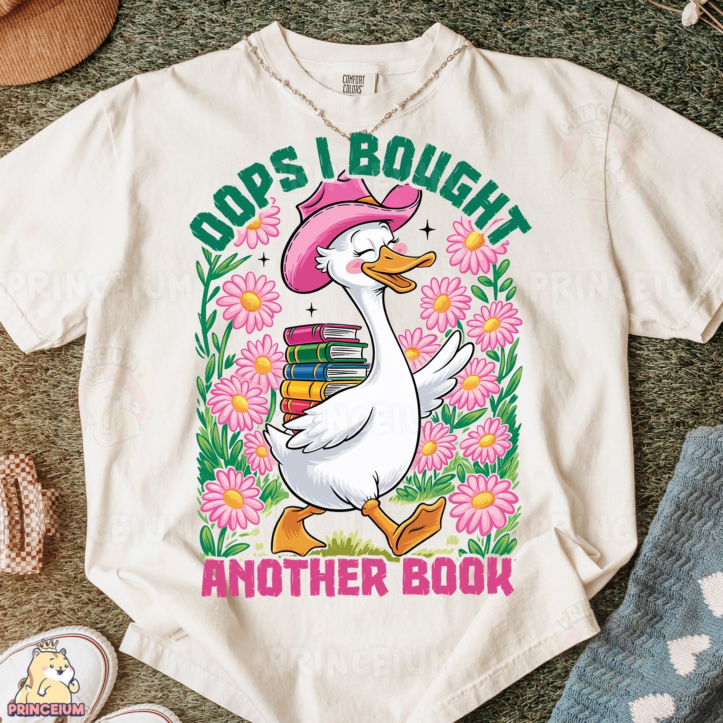a white shirt with a duck wearing a pink hat