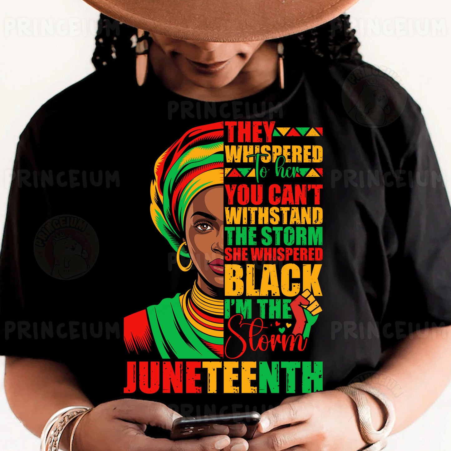 a woman wearing a black t - shirt and a hat holding a cell phone