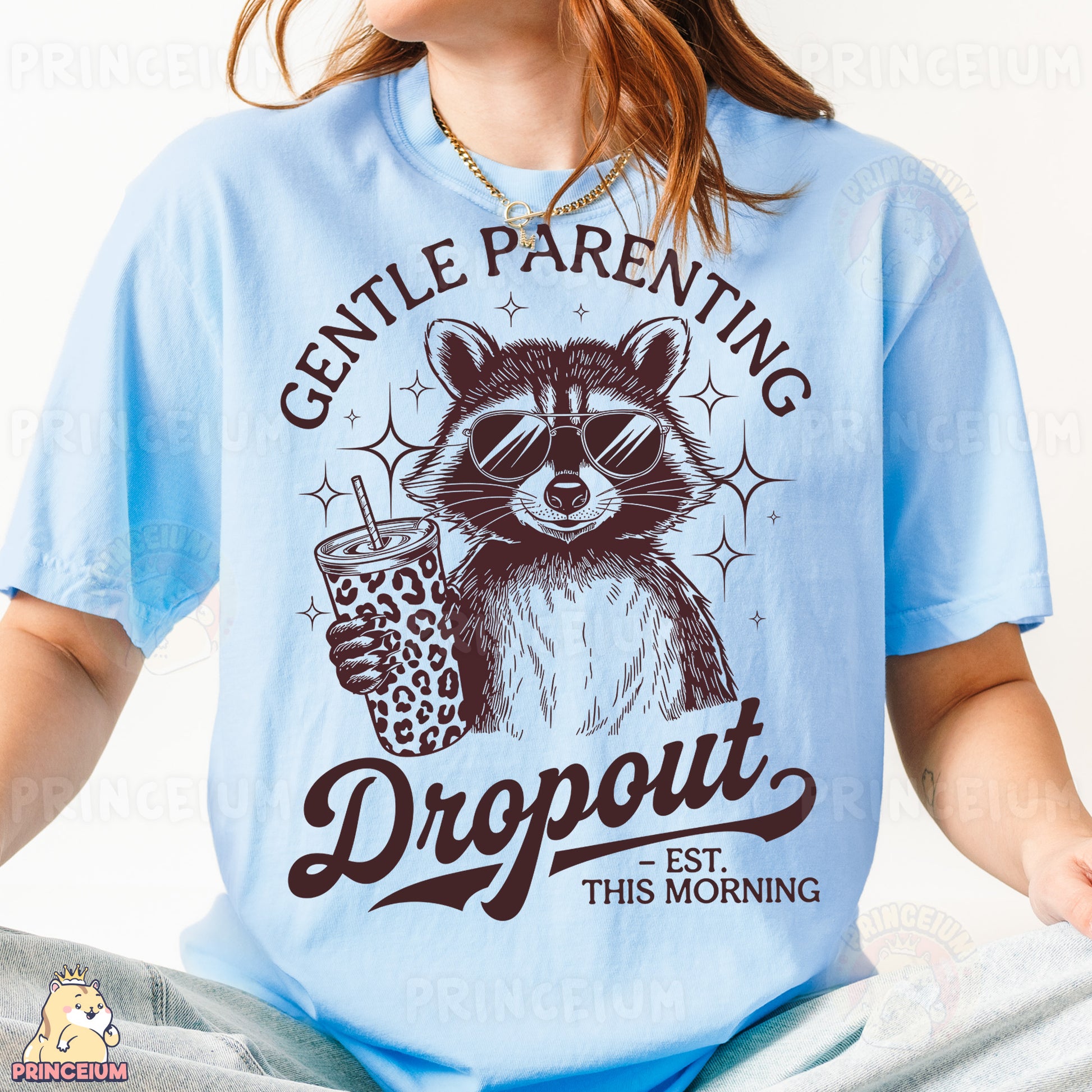 a woman wearing a blue shirt with a raccoon holding a drink