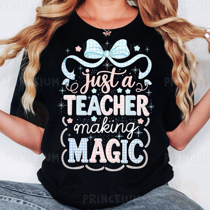 a woman wearing a t - shirt that says just a teacher making magic