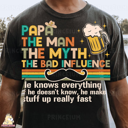 a man wearing a t - shirt that says papa the man, the myth the