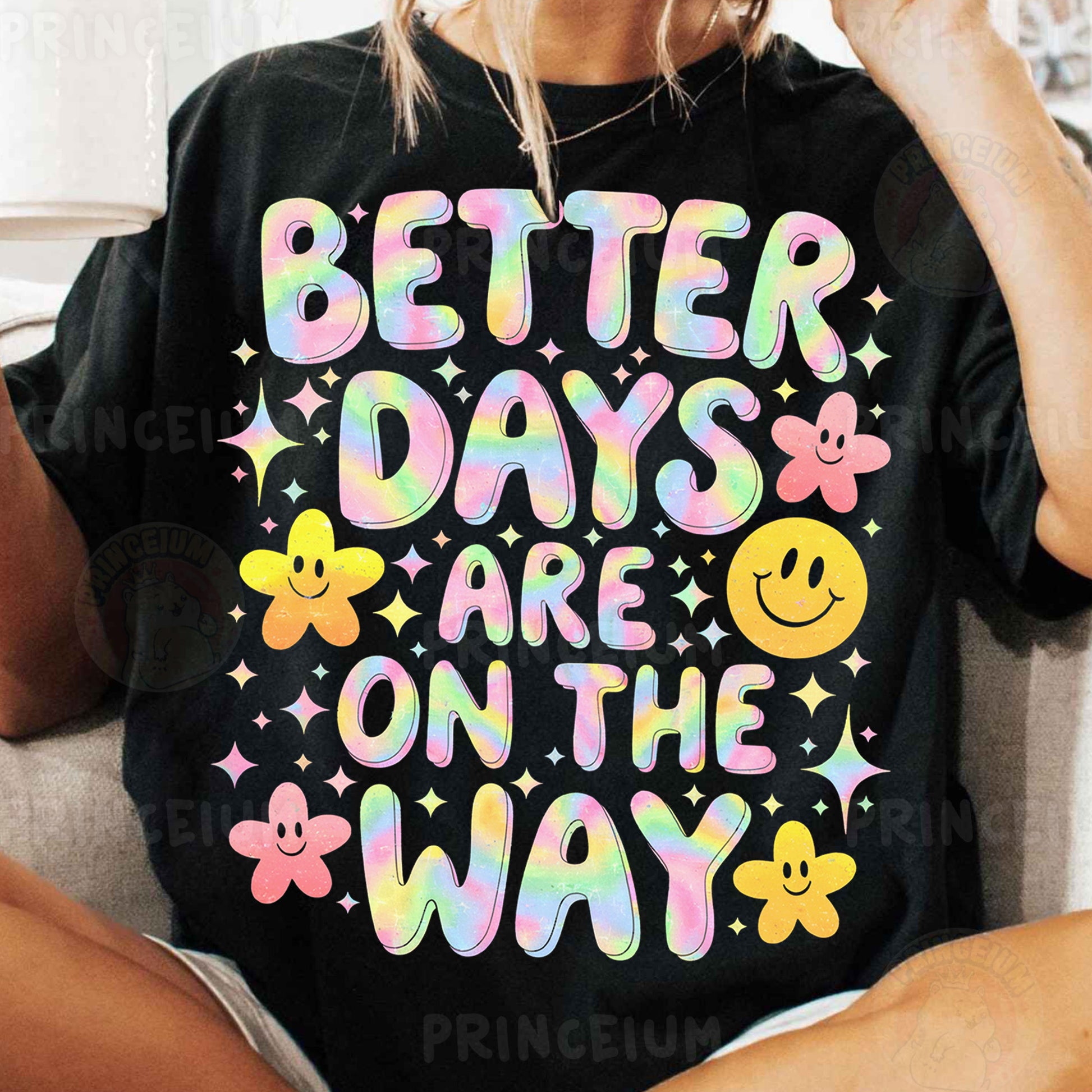 a woman sitting on a couch wearing a t - shirt that says better days are
