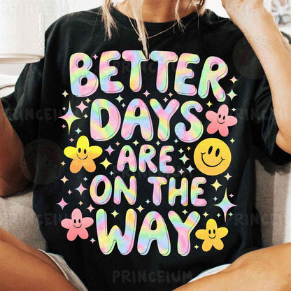a woman sitting on a couch wearing a t - shirt that says better days are