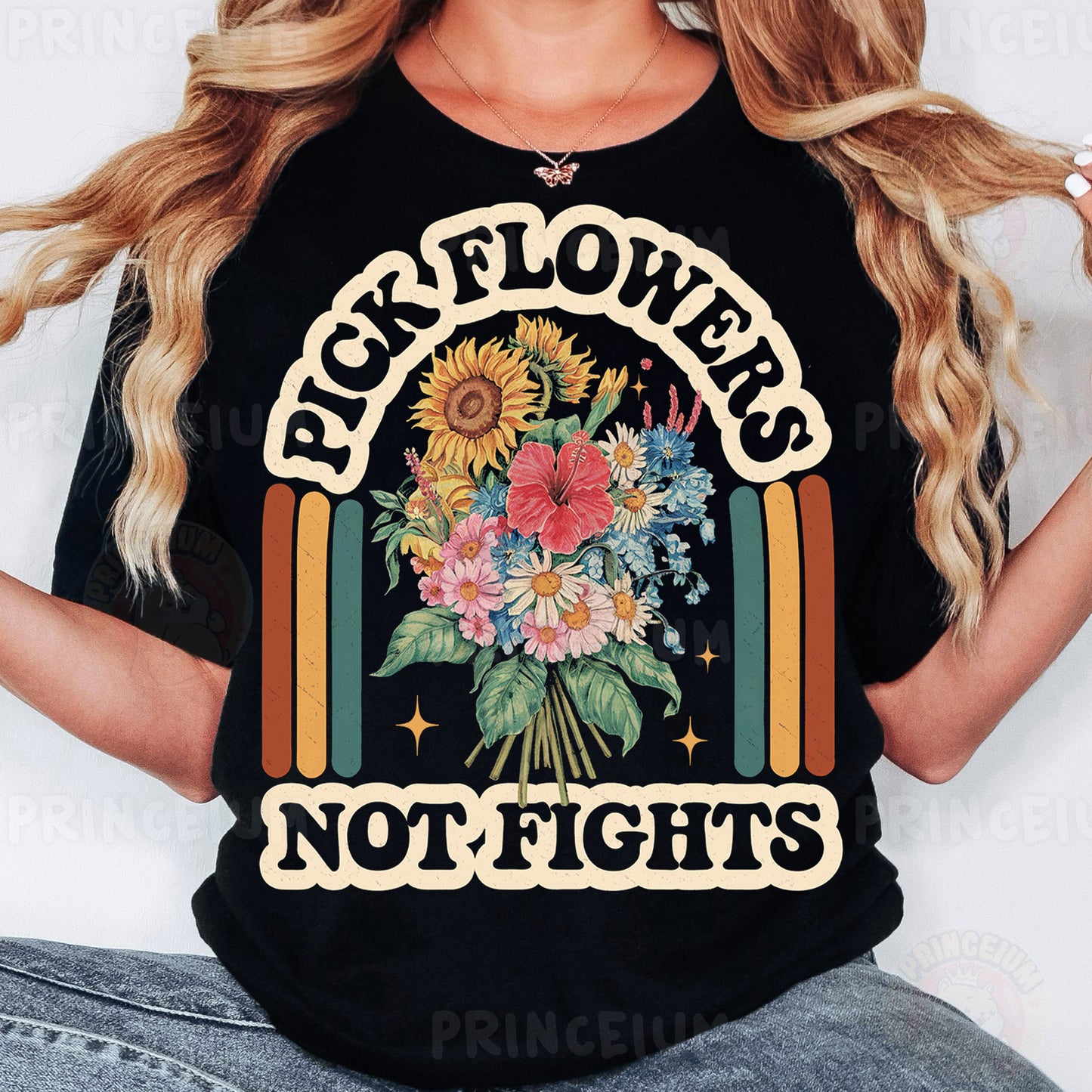 a woman wearing a black t - shirt with flowers on it