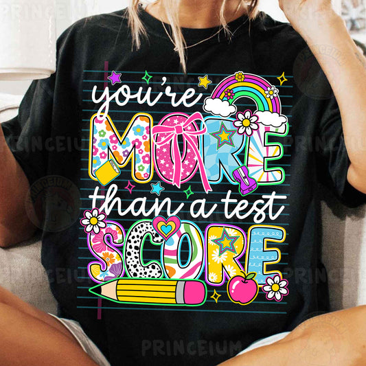a woman wearing a t - shirt that says you're more than a test