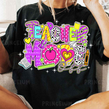 a woman sitting on a couch wearing a teacher mom shirt