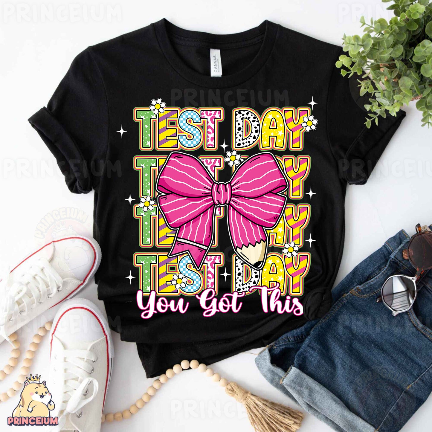 a black shirt with a pink bow on it