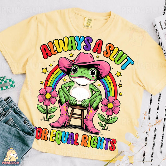 a yellow shirt with a frog wearing a pink cowboy hat