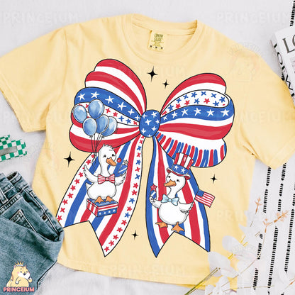 a t - shirt with a bow and balloons on it