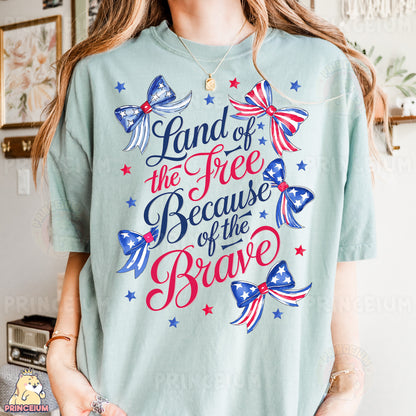 a woman wearing a t - shirt that says land of the free because of the