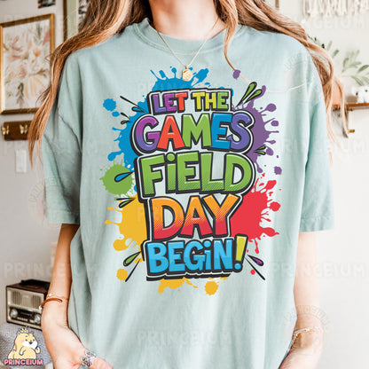 a woman wearing a t - shirt that says it the games field day begin