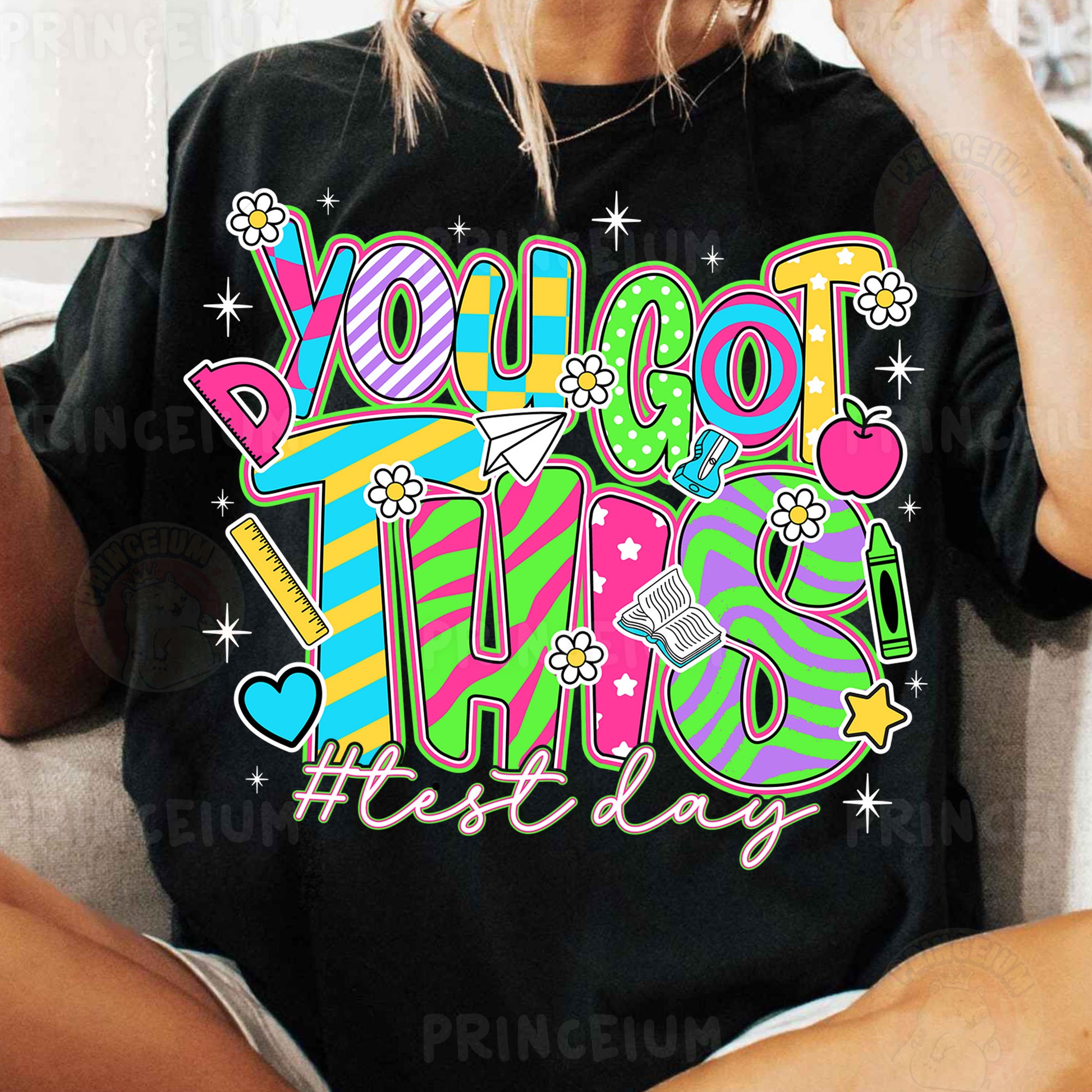 a woman sitting on a couch wearing a t - shirt that says yoloot