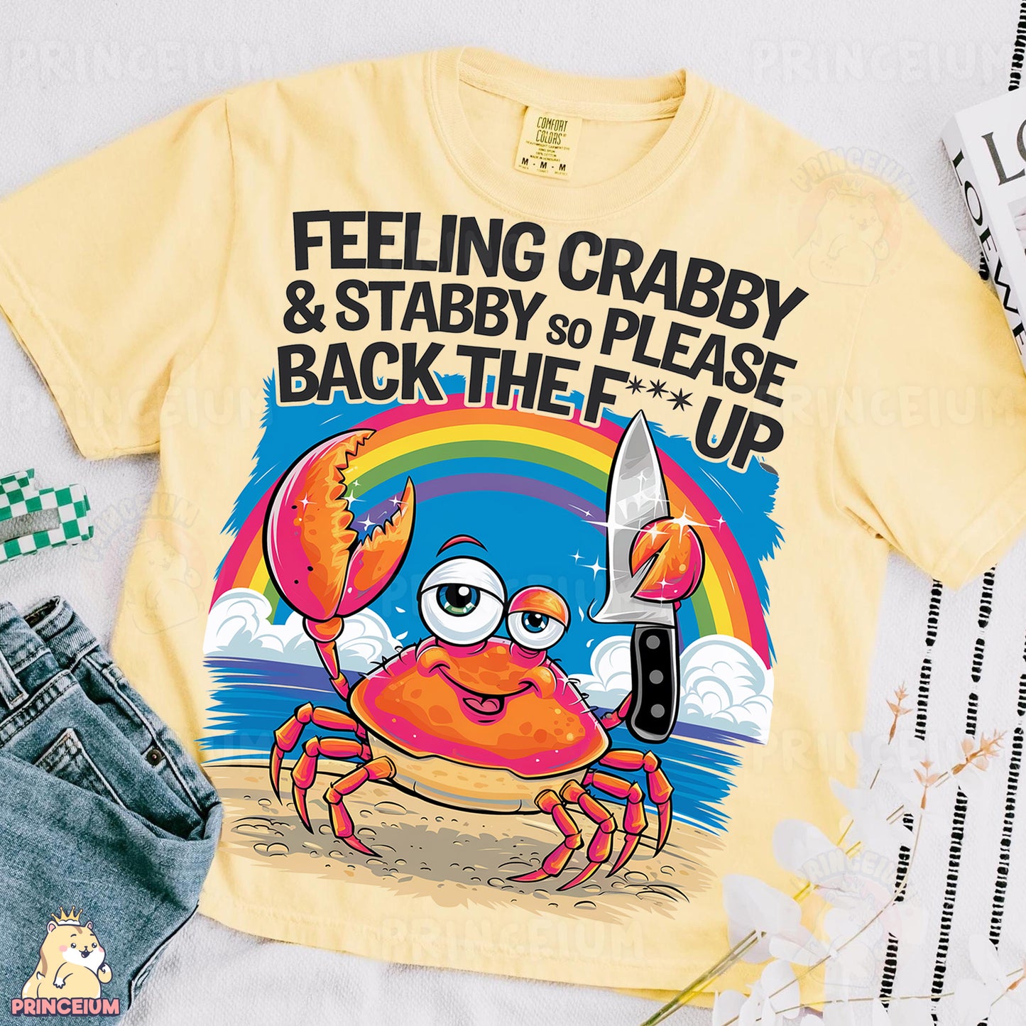 a t - shirt with a crab holding a knife