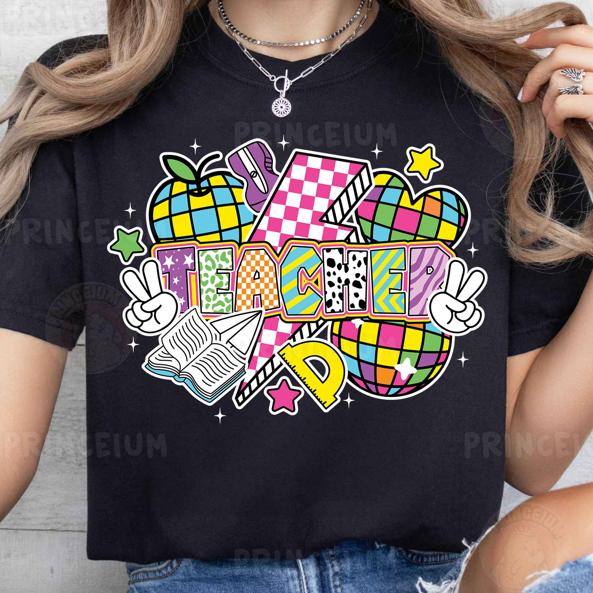 a woman wearing a black t - shirt with a colorful design on it