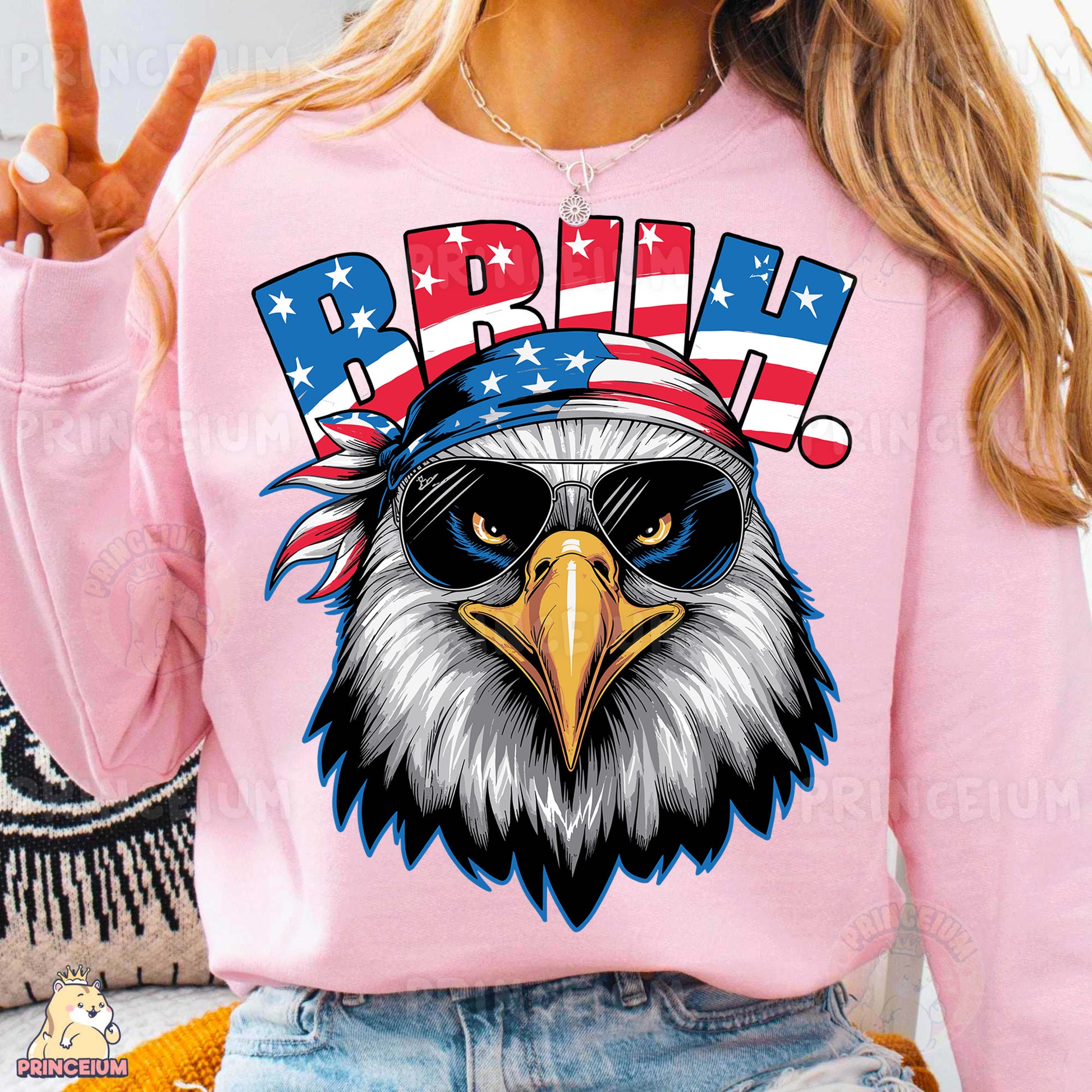 a woman wearing a pink shirt with an eagle on it