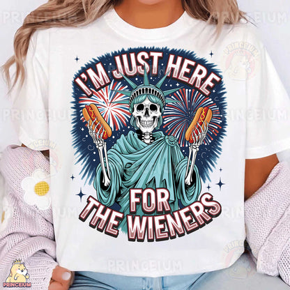 a woman wearing a t - shirt that says i'm just here for the