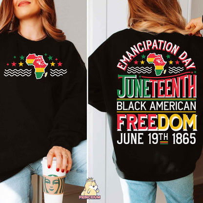 a woman wearing a black sweatshirt with a cup of coffee