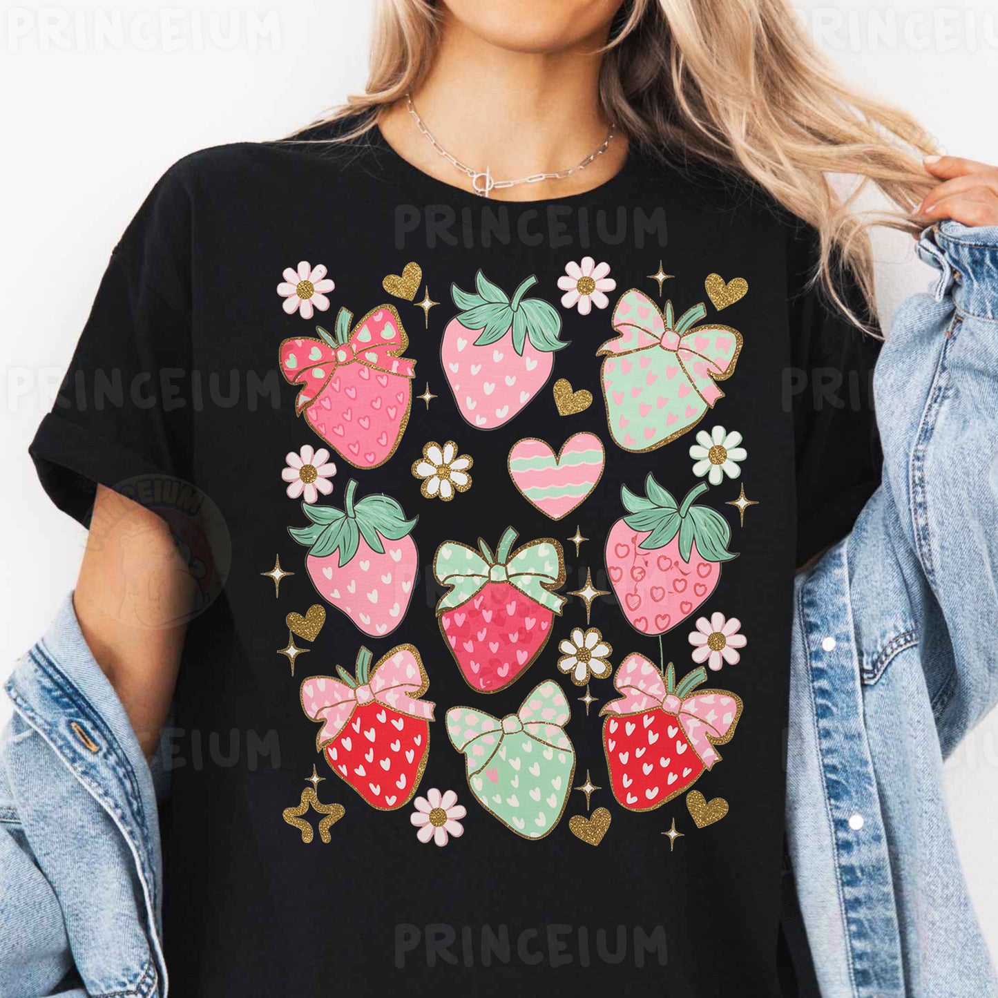 a woman wearing a black t - shirt with strawberries on it