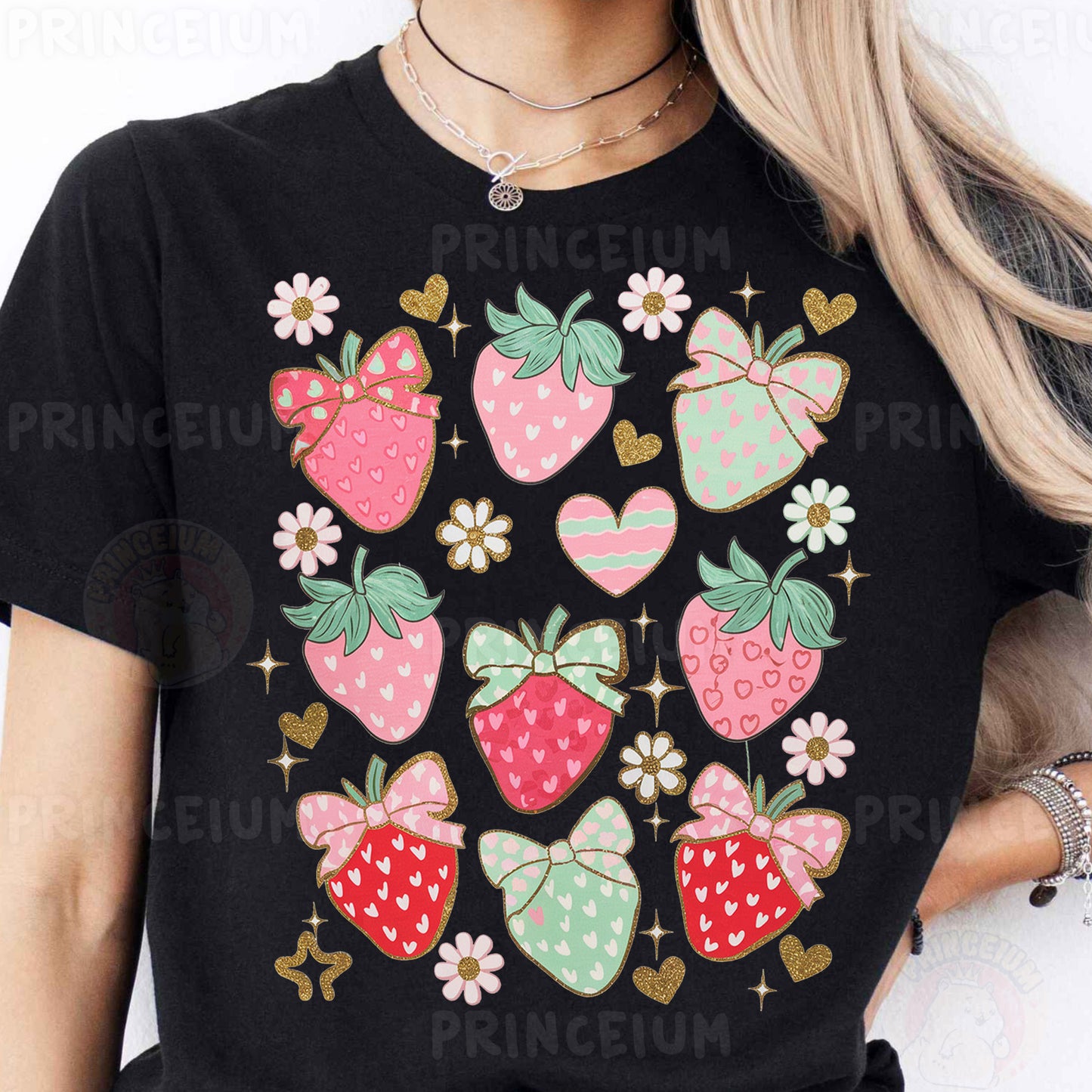 a woman wearing a black shirt with a bunch of strawberries on it