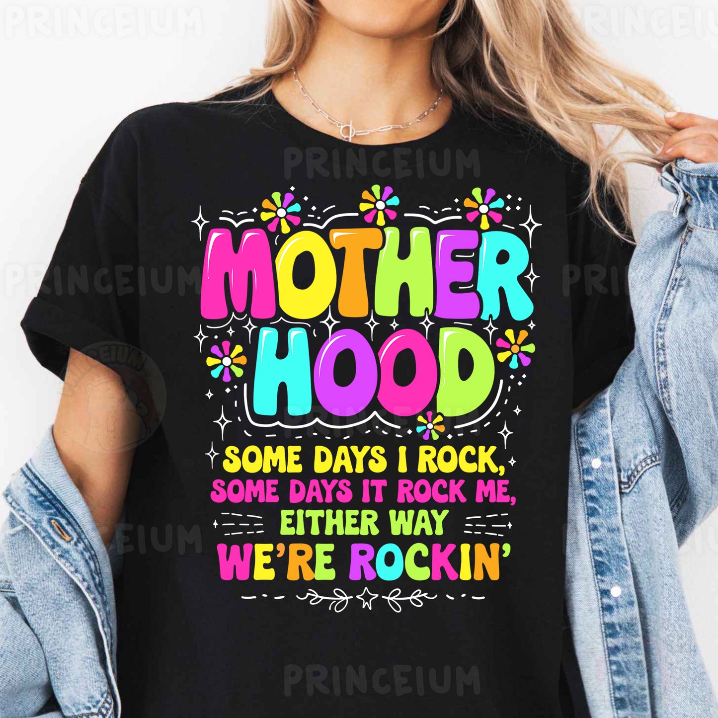 a woman wearing a black t - shirt that says motherhood some days i rock