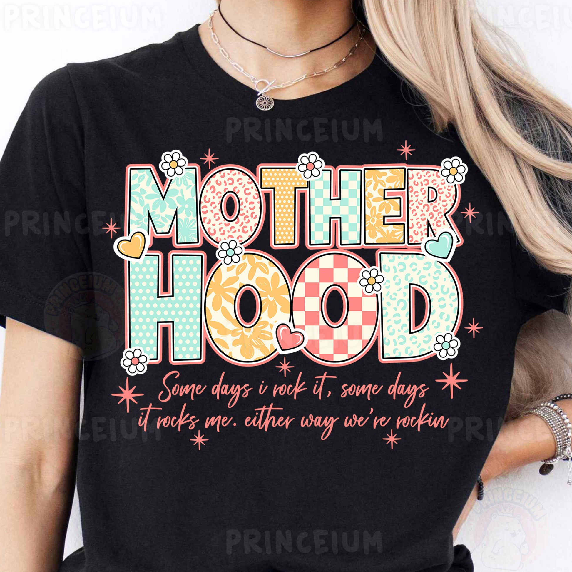 a woman wearing a t - shirt that says motherhood