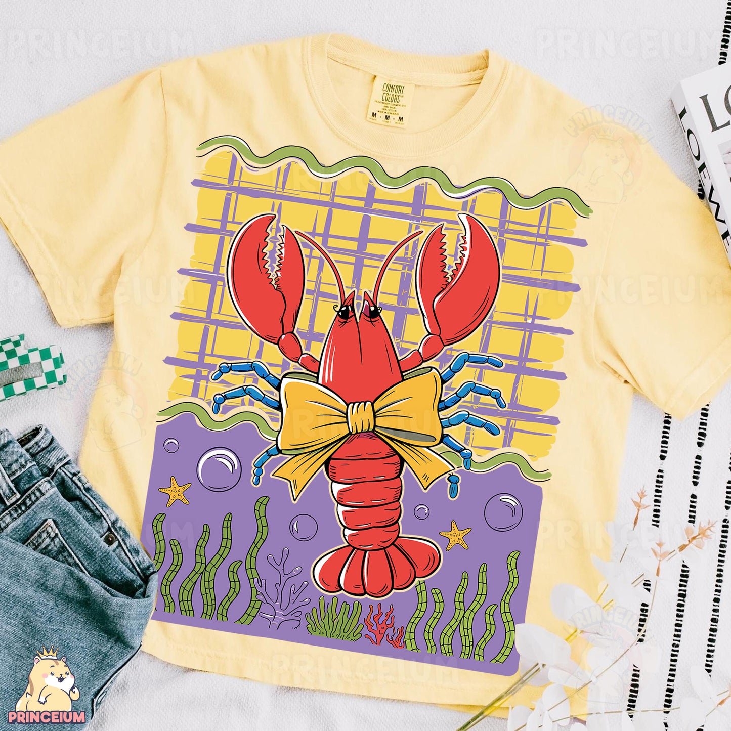 a yellow shirt with a lobster on it