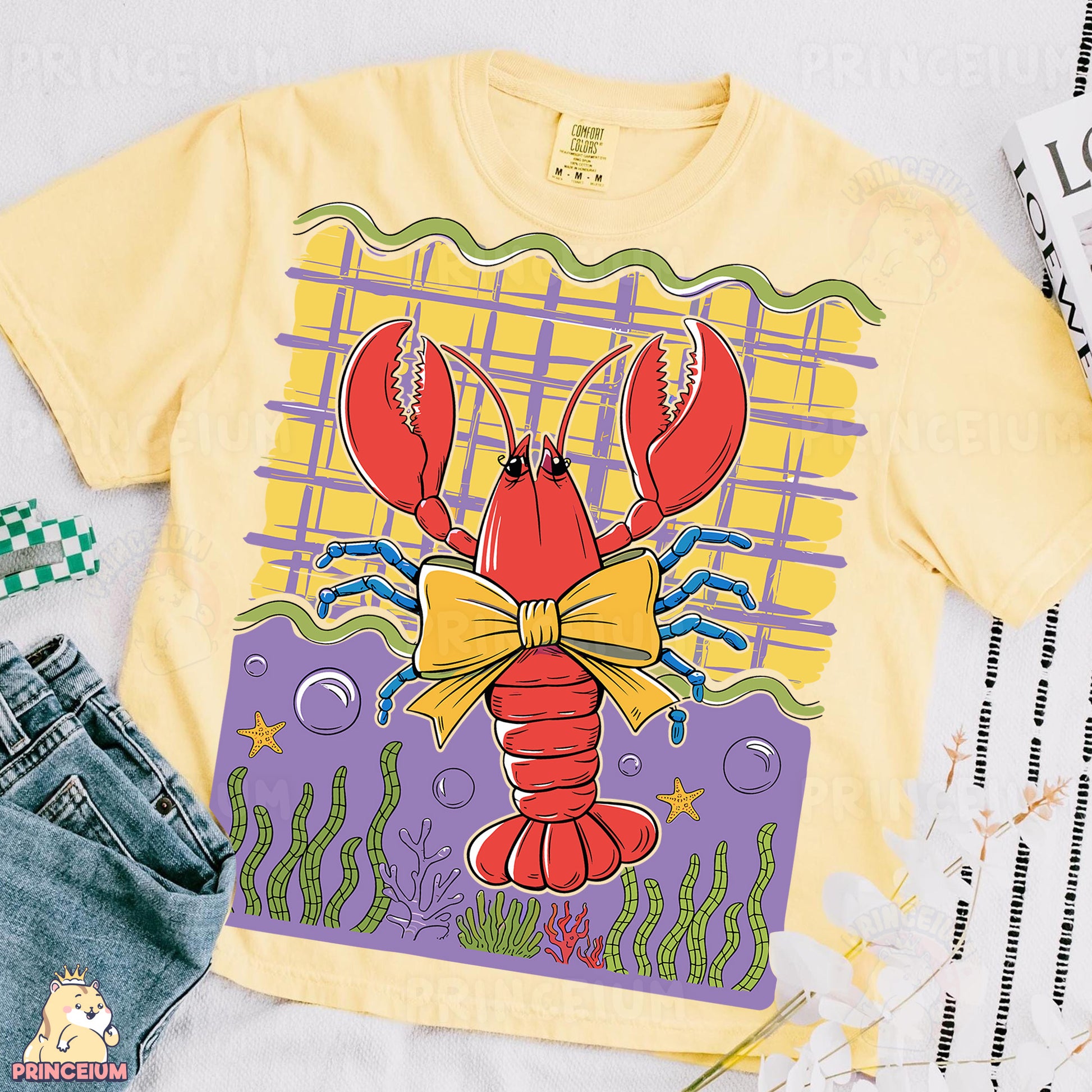 a yellow shirt with a lobster on it