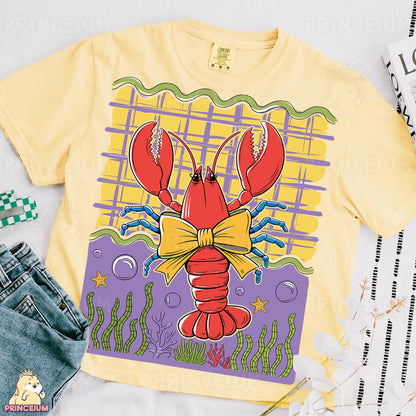 a yellow shirt with a lobster on it