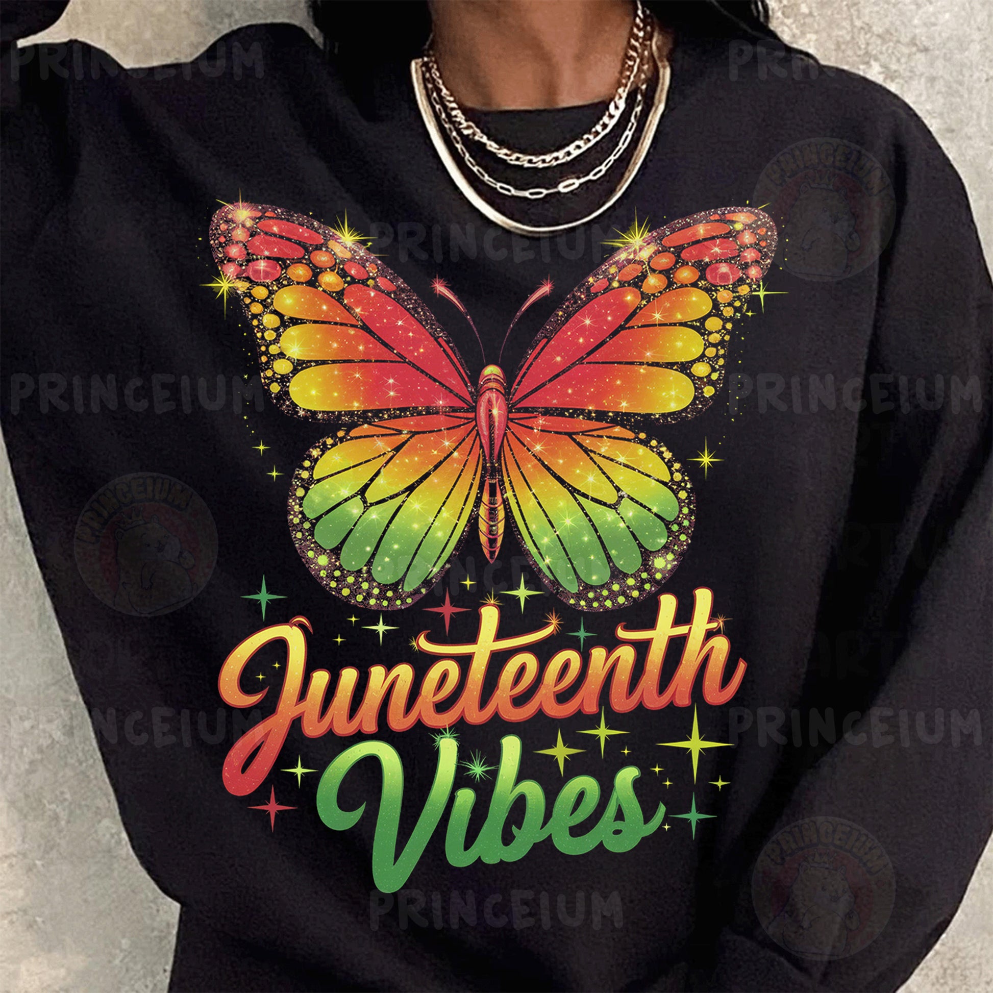 a woman wearing a black sweatshirt with a rainbow butterfly on it