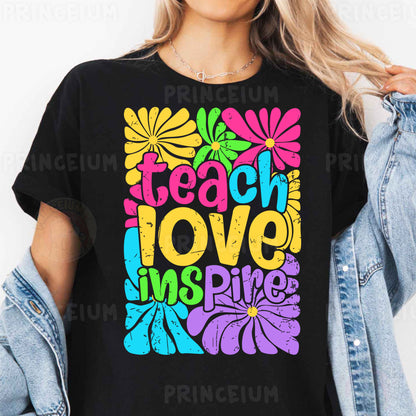 a woman wearing a t - shirt that says teach love