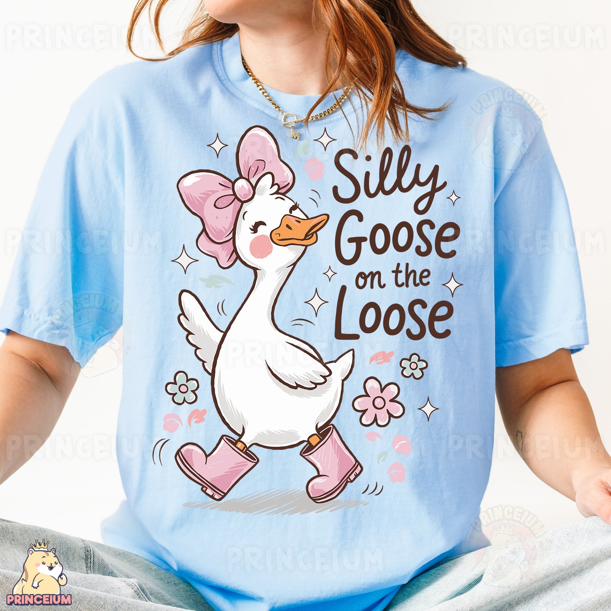 a girl wearing a blue shirt with a duck on it