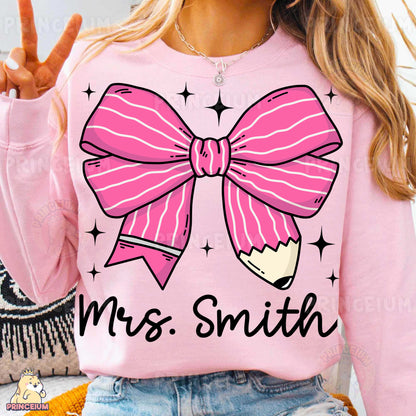 a woman wearing a pink shirt with a pink bow on it