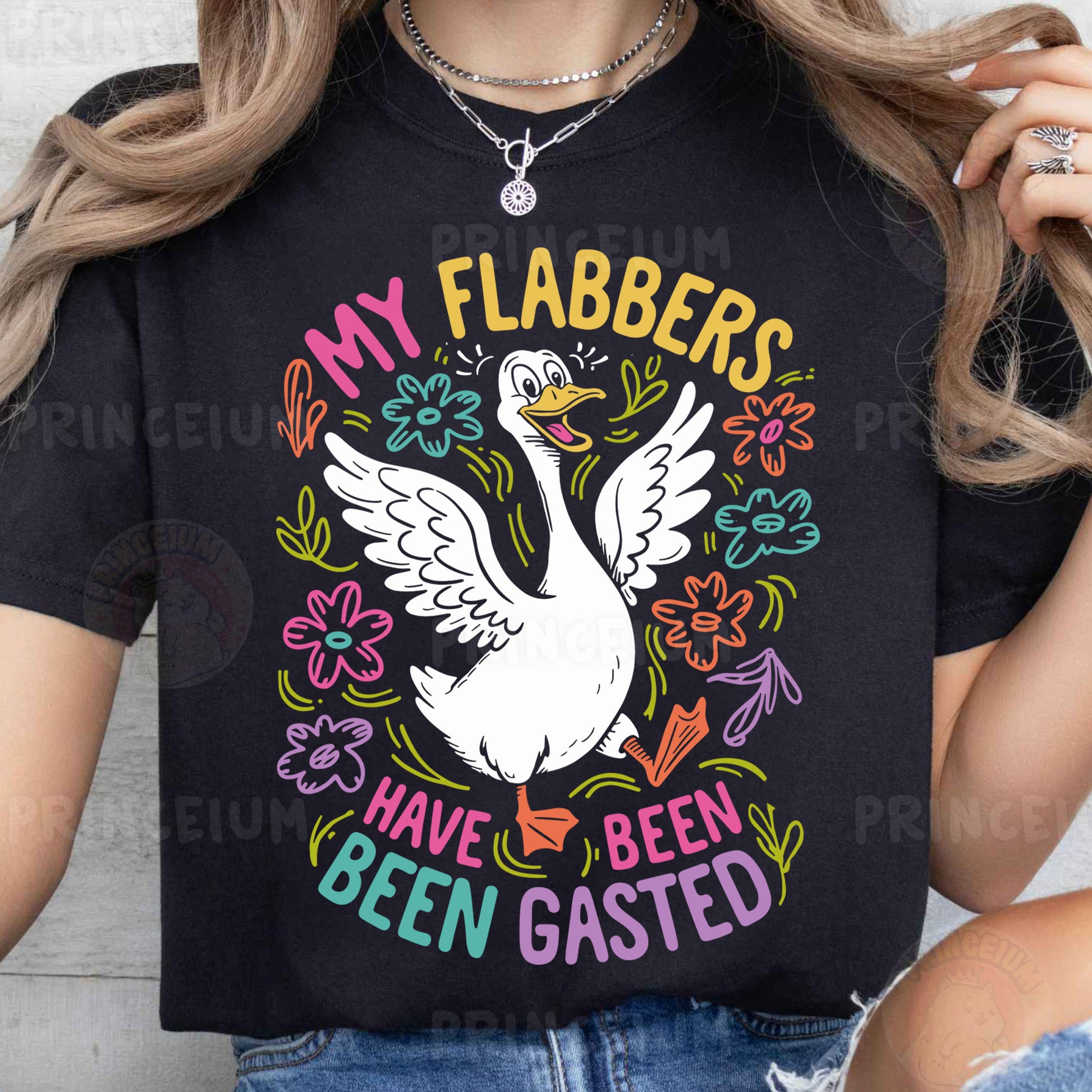 a woman wearing a black shirt with a white swan on it