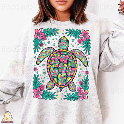 a woman wearing a sweatshirt with a turtle on it