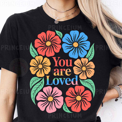 a woman wearing a t - shirt that says you are loved