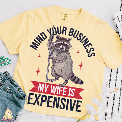 a yellow shirt with a raccoon on it