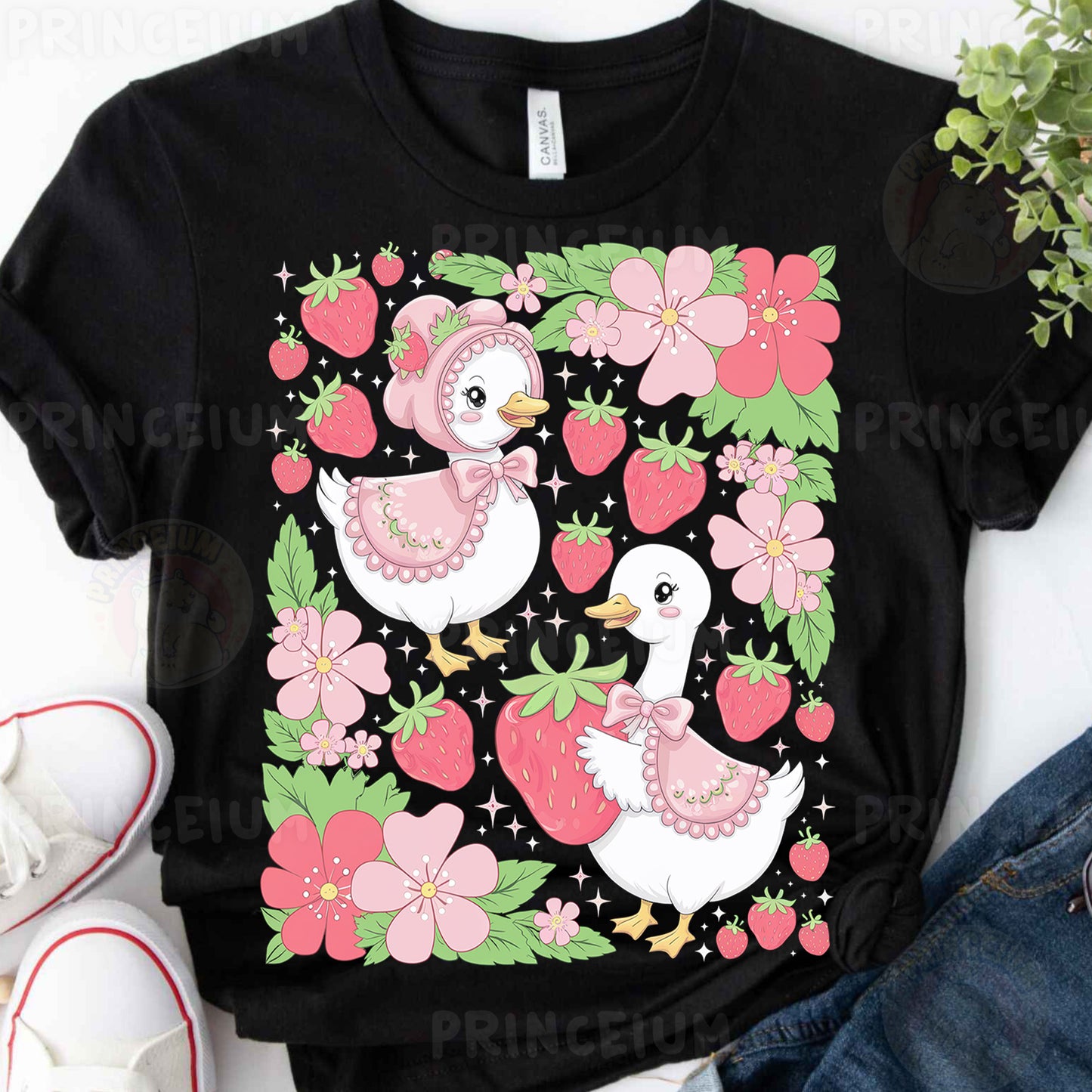 a black t - shirt with pink flowers and two ducks on it